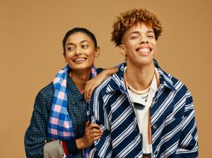 Photo of 2 people posing in a fashion shoot