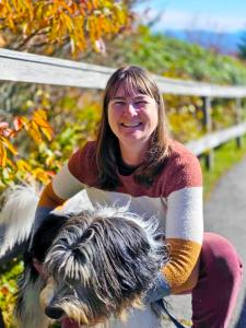 Photo of Jenni Godfrey, DVM, and her dog on a mountain hike.