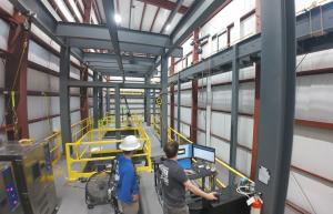 fall protection workers prepping an HLL drop test in lab