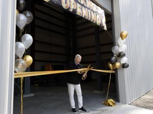 Founder Gene Verble cutting ribbon during fall protection lab dedication ceremony
