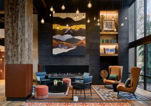 The newly redesigned lobby at Hotel Thaynes features rustic wood columns, modern furniture and a cozy fireplace