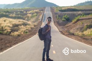 Male traveler in the middle of the road