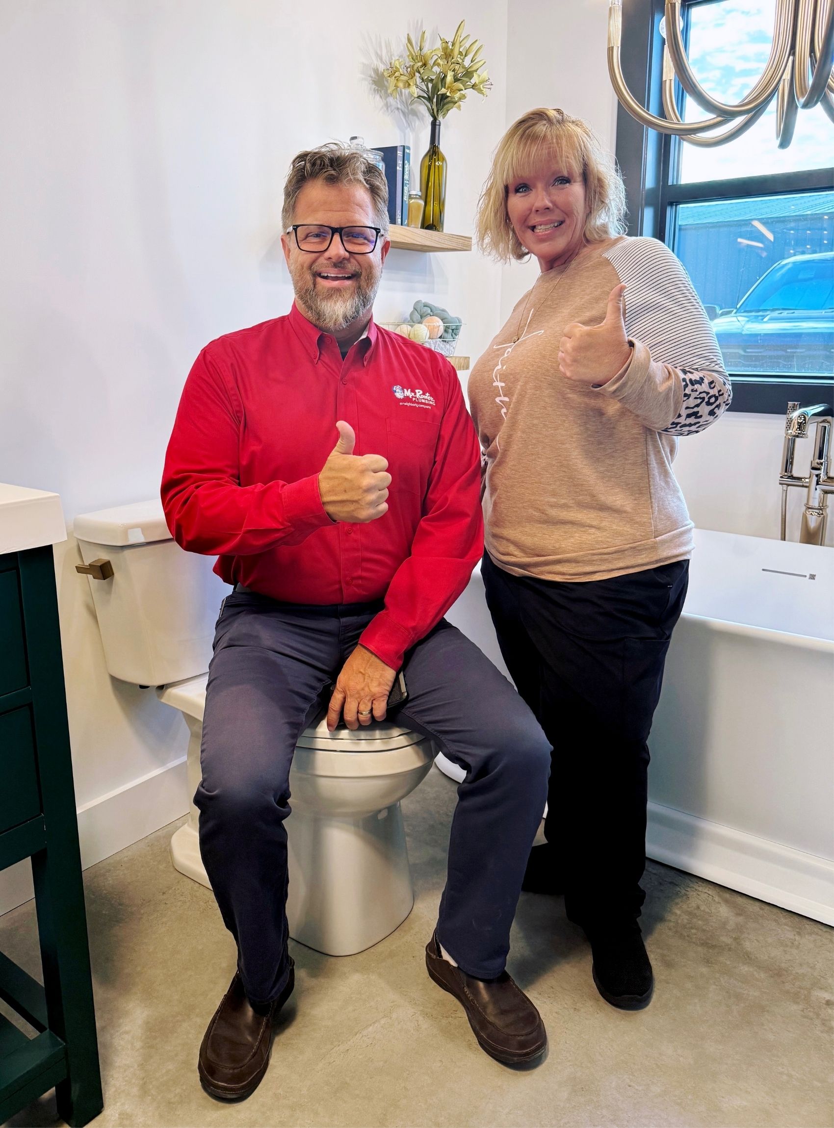 Scott Hobbs, owner of Mr. Rooter Plumbing of Northwest Florida, with Nominate Your Neighbor Giveaway Winner.