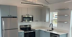 Functional and spacious kitchen with full-size appliances and stone counters