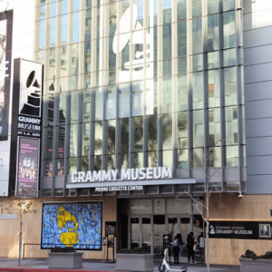 Exterior of the Grammy Museum in Los Angeles, featuring glass façade and large signage, showcasing music-themed exhibits.