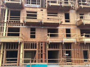 High occupancy wood frame structures such as multi-story apartment buildings often require use of fire-retardant-treated wood that has been rigorously tested before being code-approved.