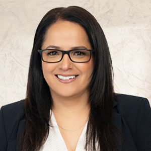 Headshot of Trial Attorney Veronica De Leon, a native Texan specializing in personal injury, leveraging her experience in insurance defense.