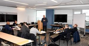 Instructor leads leadership training for police agency supervisors, focusing on accountability, communication, and real-world decision-making in a classroom setting.