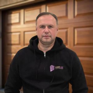 Alex Caraus performing garage door diagnostics in Chicago, IL