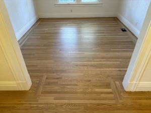 Hardwood floor refinishing in progress at a Sacramento home by Sacramento Valley Flooring