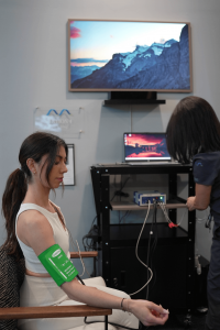 Patient seated comfortably during a 15-minute Autonomic Nervous System and Pulse Wave Analysis, a non-invasive test measuring arterial stiffness and cardiovascular resilience.