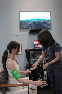 MetaLab technician connects sensors and pressure cuffs during Autonomic Nervous System and Pulse Wave Analysis to assess arterial stiffness, stress response, and nervous system balance.