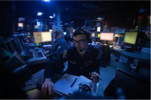 U.S. Sailors stand watch in the combat information center aboard ship. AI will enable human-machine teams to cycle through information quicker to gain decision advantage.