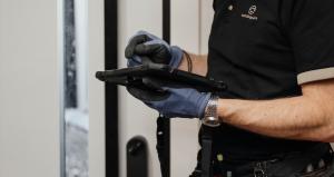 Nestology engineer configuring a smart lock within a home automation system