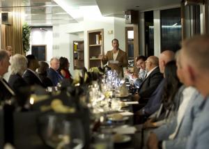 Nick Ayala leading a private Wealth Circle investor dinner with founders, operators, and capital partners.