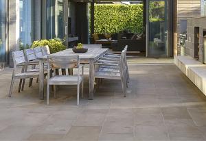 Concrete patio with an outdoor dining table.