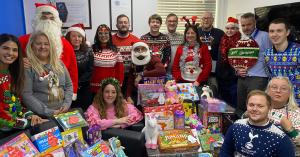 B&H Worldwide's Employees with Christmas Gifts