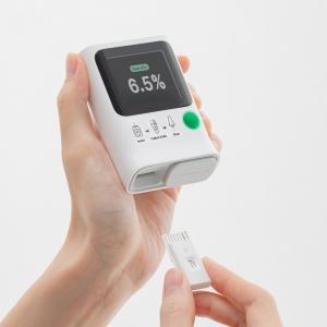 Photo of Orange Biomed's portable microfluidic A1C analysis device, OBM rapid A1c