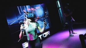Beat saber VR in mixed reality, girl and boy playing VR in Sektor