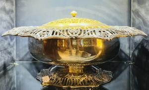 Individual silver pieces will feature this outstanding JE Caldwell sterling silver centerpiece bowl with lid, the internal container silver metal, the lid gold metal (estimate: $8,000-$9,500).