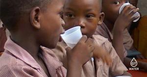School Children Drinking Clean Water in Haiti from GT Water Filtration System