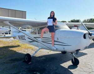 Universal Flight Training Student Celebrating Commerical Checkride Passage