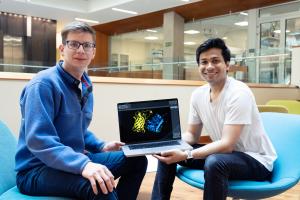 Two scientists around a laptop computer