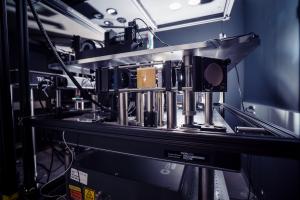 A square microscope made of long metal tubes and pillars