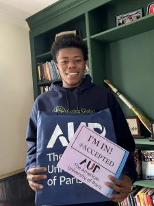 Zaahir Hardaway with AUP tote bag and "I'm in" sign
