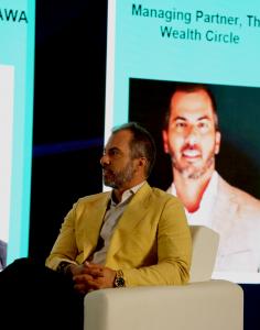 Nick Ayala speaking at a Wealth Circle pitch event with entrepreneurs and capital partners.