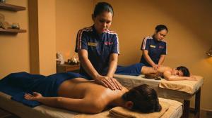 Big Apple Express Spa therapists showcase the brand's new blue uniform, designed to be more elegant and classy, while providing signature massage services at one of the newly opened branches.