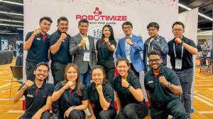 The Robotimize team posing at their booth in RehabWeek 2025, Chicago