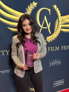 Filmmaker Nivi Jaswal-Wirtjes with Award (City of Angels International Film Festival)