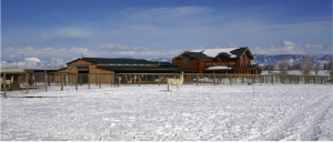 Image of the 207-acre ranch set against the backdrop of the mountains. 