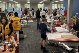 Hundreds of volunteers came together to wrap 4,000+ gifts for 40+ families