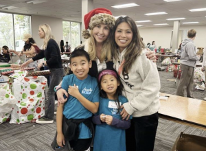Co-Founder & CEO, Autumn R. Strier, joined with volunteers, like the Ham family, as Santa's helpers