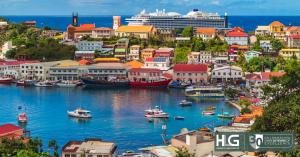 Scenic view of the Caribbean island of Grenada with a cruise ship in the background as HLG explains the importance of changes to Caribbean CBI programs.