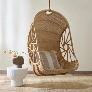 Garden swing chair styled on a small balcony with plants