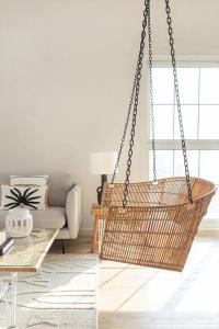 Outdoor egg chair on balcony with soft cushions