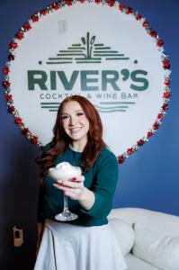 River's Cocktail Bar Bartender With Christmas Cocktail