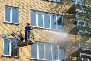 Facade cleaning yellow bricks on a home. Nano Banana AI-generated image