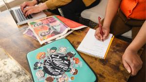 Creative Repute project and account managers reviewing design and development work during a team meeting