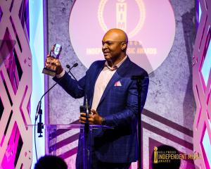 F. Mills holding the Best Rap/Hip-Hop award for his song “Still” at the Hollywood Independent Music Awards in Los Angeles.