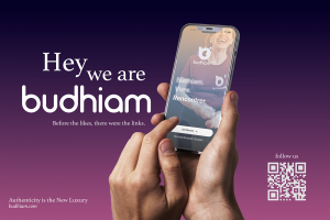 Hand holding smartphone displaying Budhiam app interface with tagline "Before the likes, there were the links" - Franco-British startup connecting people for authentic conversations in Confidence Cafés