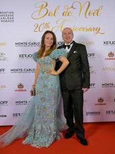 Marvin Schertl and Dr. Sina Schertl posing on the red carpet at the 20th Anniversary Christmas Ball Bal de Noël in Monaco.