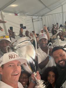 Don Wright celebrates his first-place finish at DJ Khaled’s ‘We The Best’ Golf Classic, proudly holding the championship trophy while representing Madison Insurance Group.