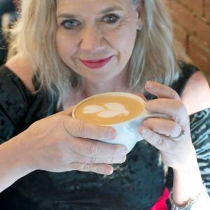 Diane Brandon Moody is drinking coffee. She is a dating coach for women over 50.