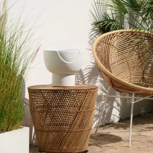 Rattan side tables paired with concrete side tables UAE