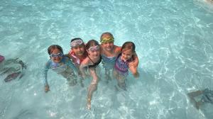 Children attending YMCA of Middletown summer camp at Camp Robbins during outdoor activities.