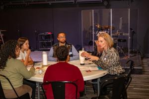 Prima Consulting CEO Shanna Weber discusses financial literacy with Denver-area students. (Photo by Travis Broxton)